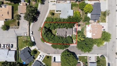 Aerial view of residential area featuring property boundaries highlighted