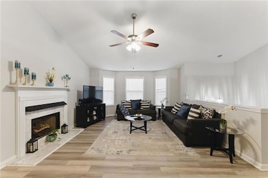 Living area with wood finished floors, baseboards,