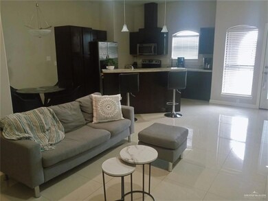 Living room with light tile patterned floors