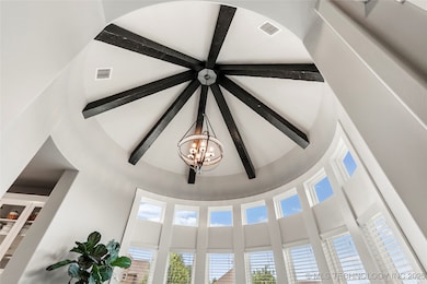 Soaring Ceiling with beams in Dining Room