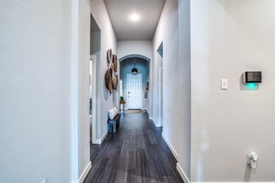 Hallway with dark vinyl wood-style flooring