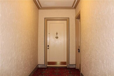 Hall and entrance to 2A notice service entrance to