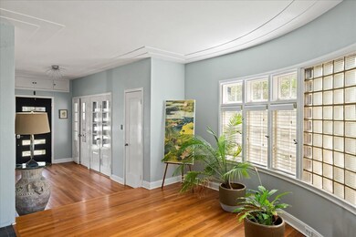 Entryway with baseboards, wood finished floors, a