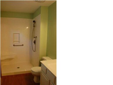 Remodeled bathroom with large, walk in shower.
