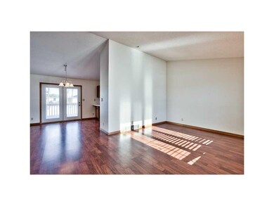 Living Room. NEUTRAL WALL COLOR, UPGRADED WOOD LAM