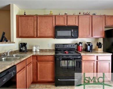 Kitchen. Lots of Cabinet Space. Open to Livng with