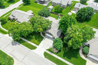 Mature trees and lush lawn.