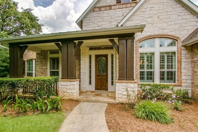 brick and stone elevation with covered front patio