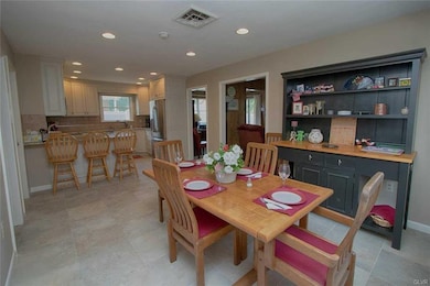Open layout with dining area and updated kitchen.