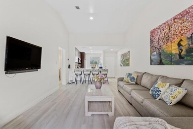 Spacious living room with laminate flooring and vo