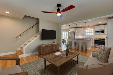 Cozy open concept living and kitchen. Photo virtually staged.