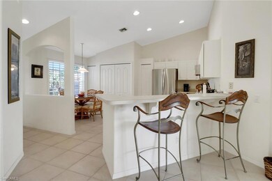 Kitchen with visible vents, light countertops, a p
