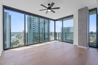 Spare room with a city view, wood finished floors