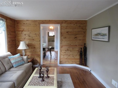 Living room with hardwood / wood-style flooring, c