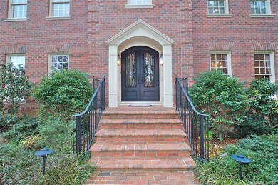Double iron doors welcome you home.