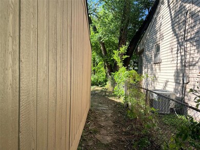 View of side of property with central AC unit