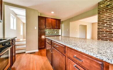 Butler's pantry with glass tile back splash.