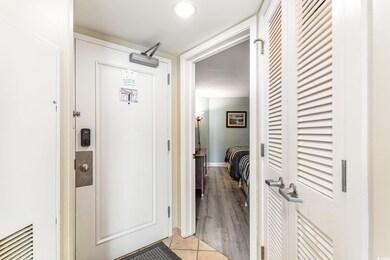 Hall with light hardwood / wood-style flooring