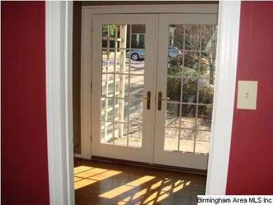 Sunroom or office with french doors leading to sid