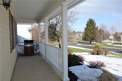 Huge front porch is perfect for enjoying the quiet neighborhood activity.