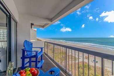Balcony featuring a water view and a view of the b