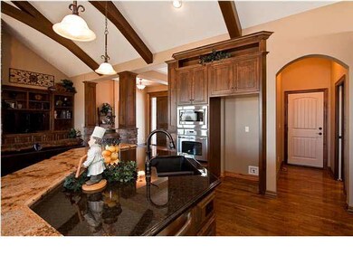 Kitchen has large unique step island and eating ba