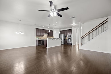 Unfurnished living room with a chandelier, a ceil