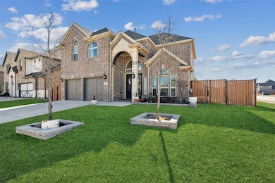 View of front property with a garage and a front y