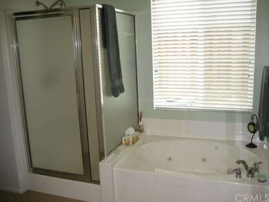 Bathroom features spa tub and walk in shower