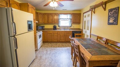 The homey kitchen has great cabinet and counter sp