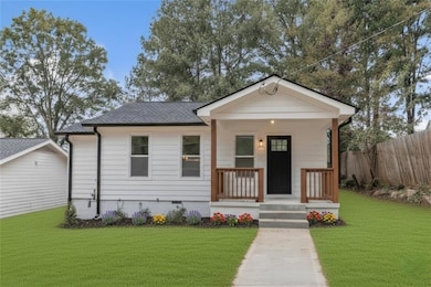 View of front of home featuring covered porch, crawl space, and roof with shingles