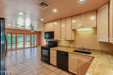 Kitchen open to family room with views to the backyard