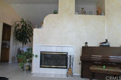 Two way fireplace warms the living and family room