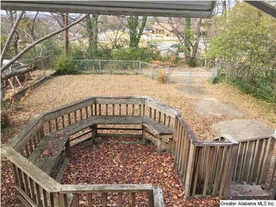 View out kitchen window into back yard, no rear ne