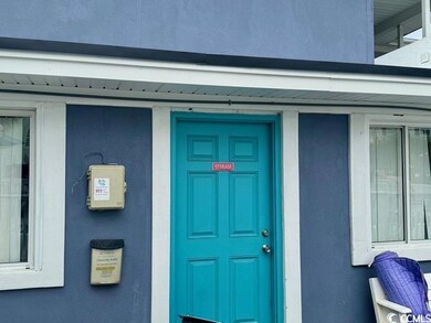 Entrance to property featuring stucco siding
