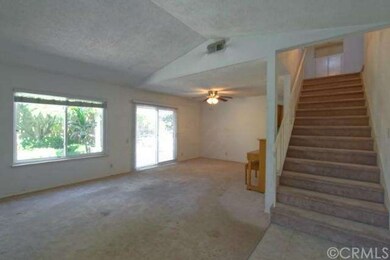 View of Dining Area and Wide Staircase