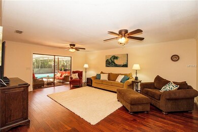 Spacious living room with a view straight to the pool.
