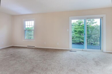 Bright and airy living room with second story deck