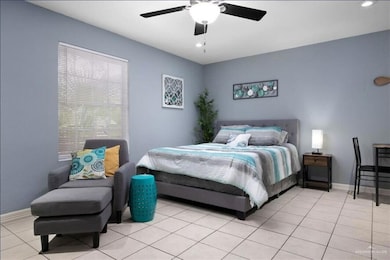 Bedroom featuring recessed lighting, ceiling fan, and light tile patterned floors