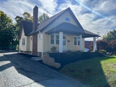 EXTERIOR FRONT AND SIDE OF HOME