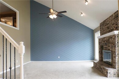HUGE living room open to kitchen and dining above.