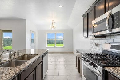 This lovely kitchen has stainless steel appliances! Refrigerator, washer and dryer are included!