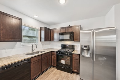 Functional Kitchen Featuring Ample Cabinet and Cou