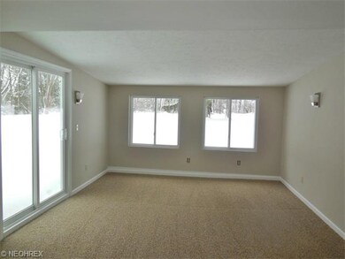 Family Room with newer wall to wall carpeting, sli
