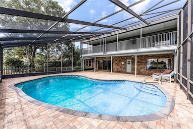 Beautiful two-story screened lanai with brick pavers. The 40x40 upstairs balcony is a great spot to catch the views!