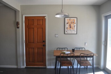 Eat-in kitchen showing door to carport
