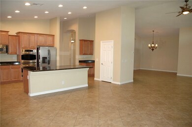 Open floor plan with vaulted ceilings.  Kitchen wi