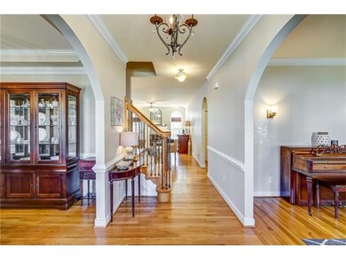 The offset hardwood stairs have decorative iron sp