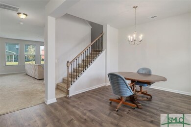 Dining room and stairs leading to second story