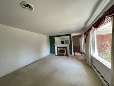 Unfurnished living room   a brick fireplace, light